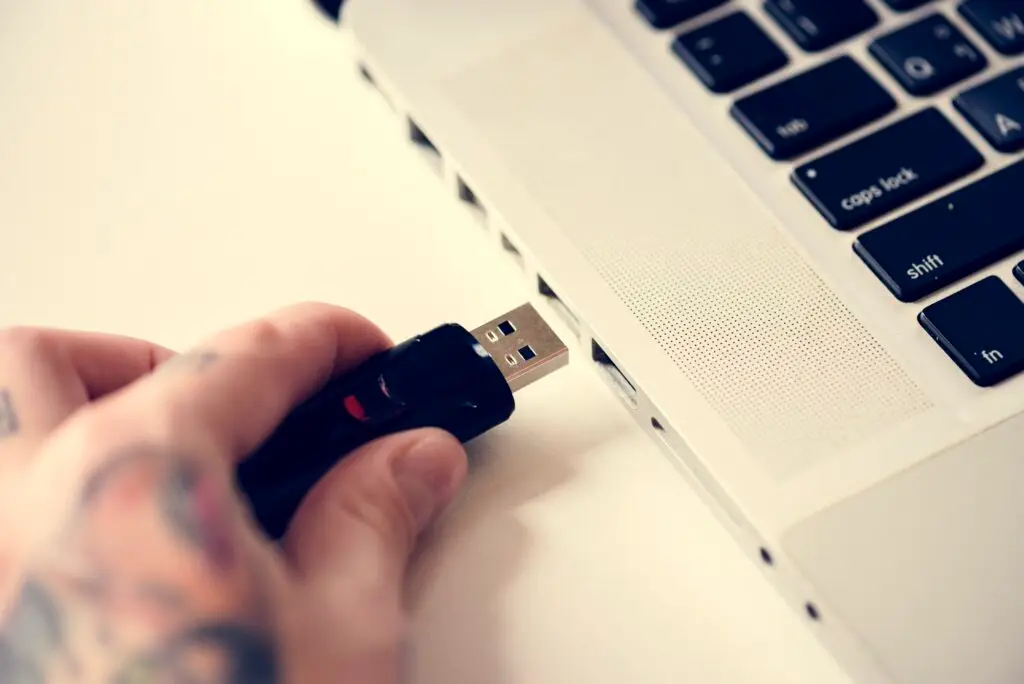 Hand holding Universal Serial Bus portable data backup