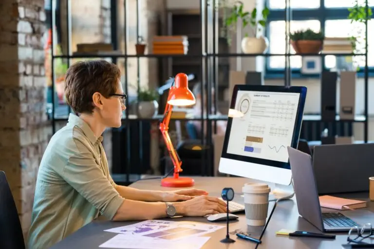 Businesswoman working with statistics on computer