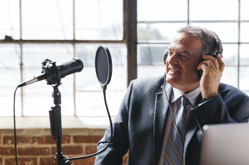 Businessman recording a podcast