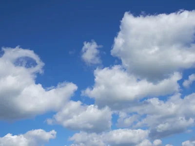Cumulonimbus clouds. White cumulonimbus clouds floating in the blue sky.
