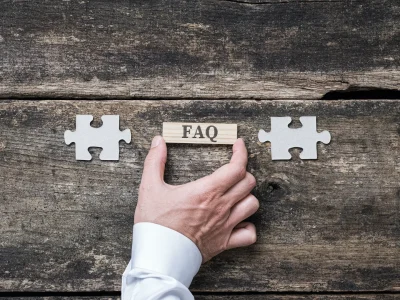 FAQ sign on wooden peg