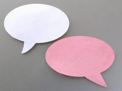 two-bottles-of-speech-on-a-gray-background